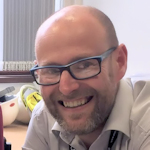 Profile of a man smiling
